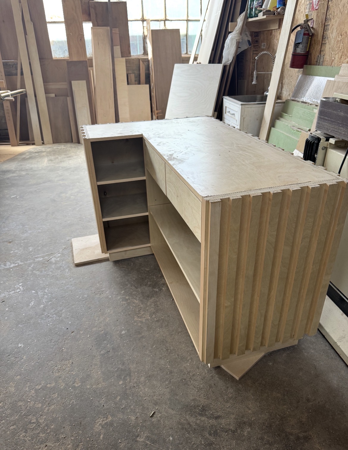 Commercial display counter with drawers and open shelving