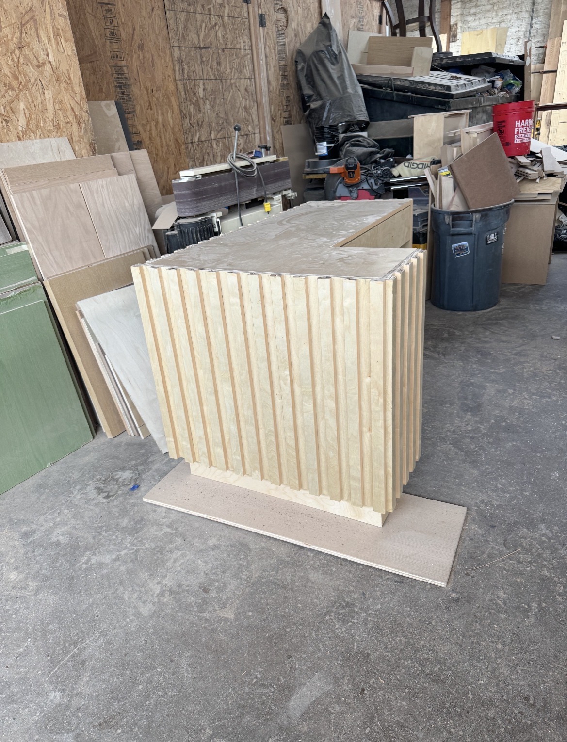 Fluted reception counter under construction in the shop